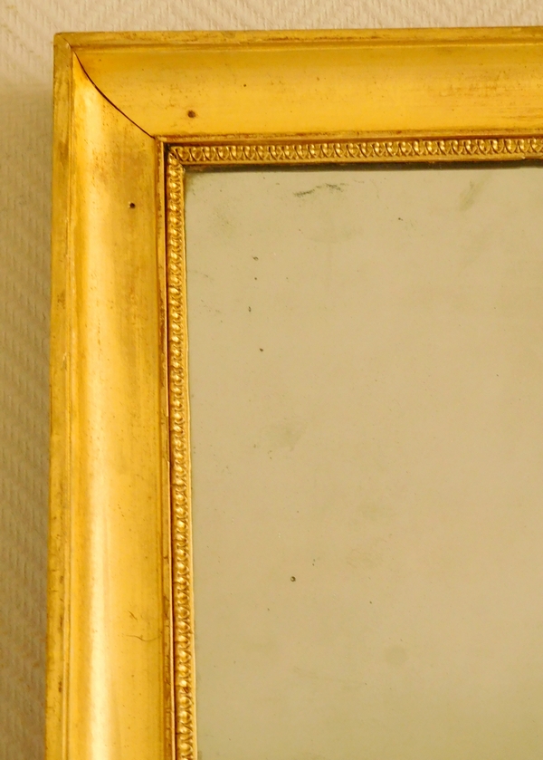 Miroir d'entre deux ou de cheminée d'époque Empire en bois doré, glace au mercure - 141cm x 76cm